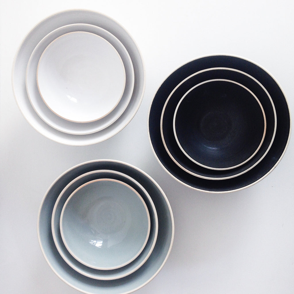 Handmade Ceramic Nesting Bowls in White, Black, and Blue