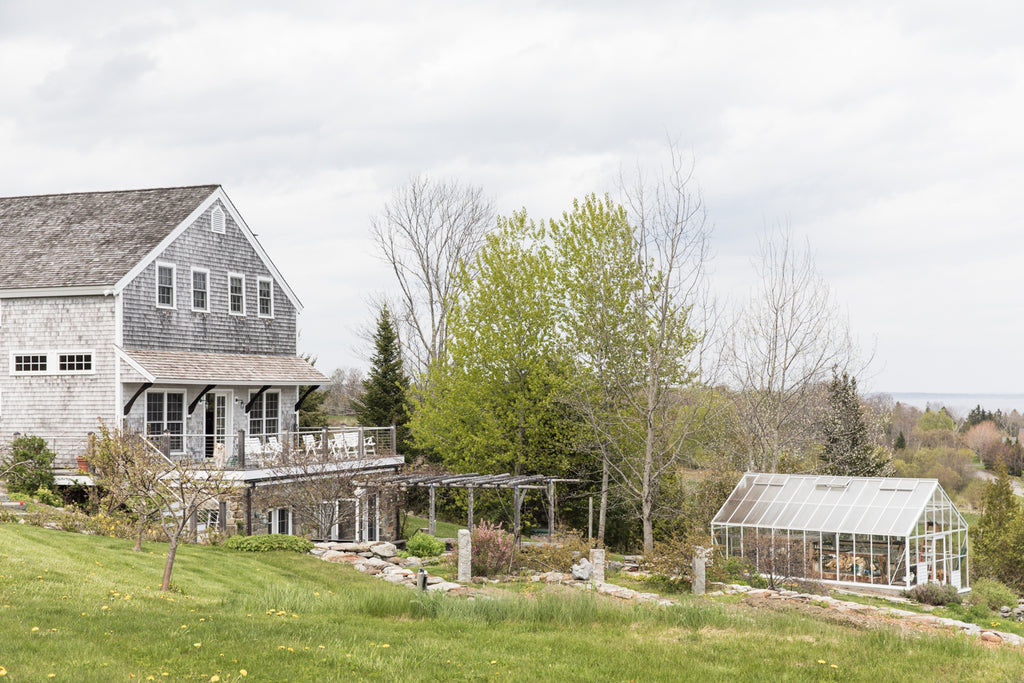 View of the Salt Water Farm farmhouse and greenhouse. 